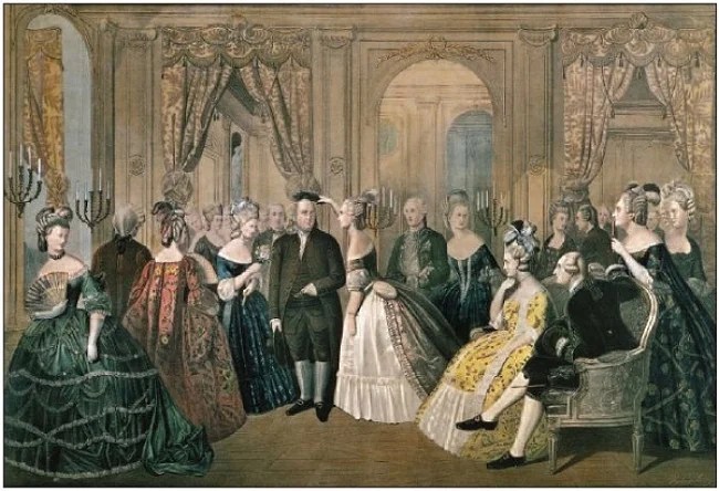 A historical gathering featuring elegantly dressed men and women in 18th-century attire, with intricate gowns and hairstyles, standing in a lavishly decorated room.
